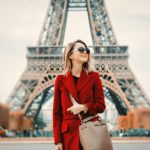 girl in red coat and bag at parisian street