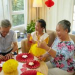 Girl Making Garland with Grandparents
