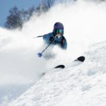 Male skier swerve skiing down mountain, Alpe-d'Huez, Rhone-Alpes, France