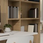 side view, Minimal and comfortable office workspace with computer mockup, wooden shelves